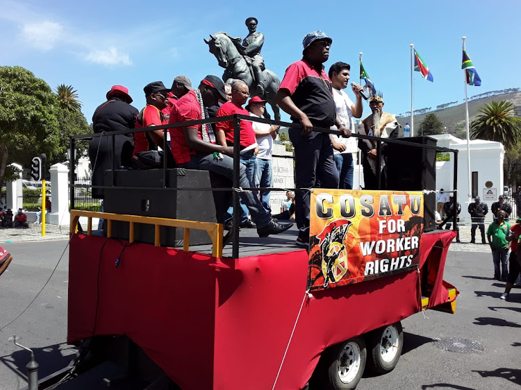 Cosatu leaders address marchers outside parliament on February 19 2019.