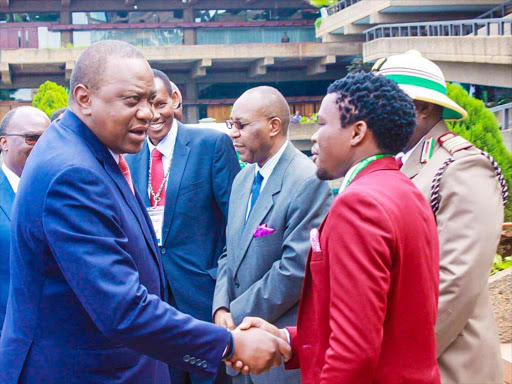 President Uhuru Kenyatta with Nacada Board Member Chipukeezy during the opening of the first international conference held at KICC on the 10th December 2018