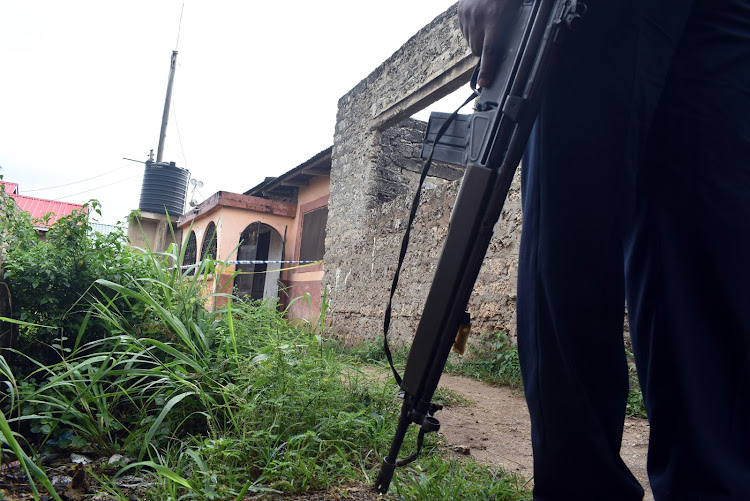 Police officer at a scene of crime in Likoni, Mombasa.