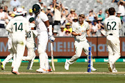 Cameron Green of Australia celebrates his fifth wicket, of Lungi Ngidi, in the first innings on day one of the second Test agianst South Africa at the Melbourne Cricket Ground on December 26 2022. 