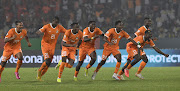 Hosts Ivory Coast celebrate winning on penalties in their Africa Cup of Nations last 16 match against Senegal at Stade Charles Konan in Yamoussoukro on Monday night.