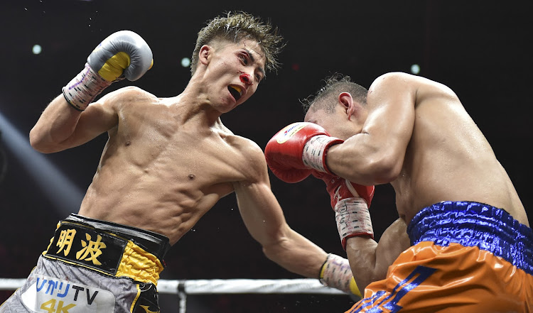 Naoya Inoue of Japan (L) and Nonito Donaire of Philippines (R) fight in their World Boxing Super Series bantamweight final at Saitama.