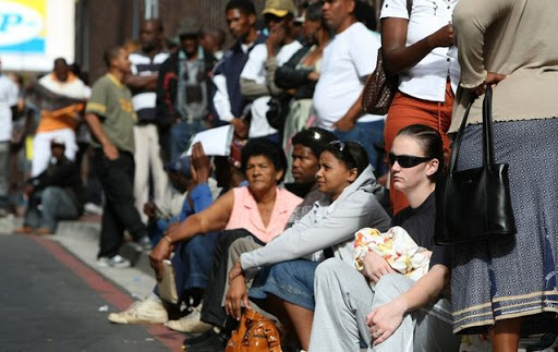 Unemployed people queue for UIF payments.