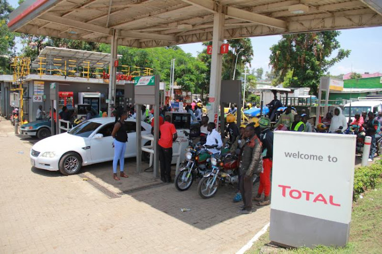 Boda boda riders and motorists scramble for fuel at a petrol station in Homa Bay on March 31,2022.