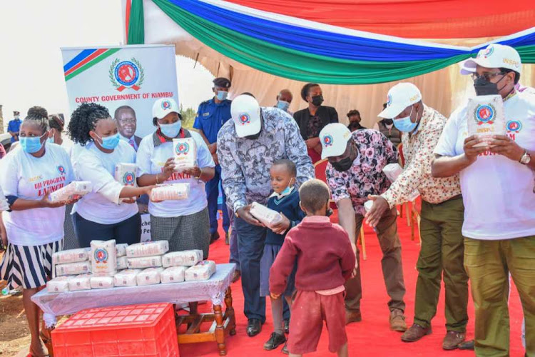 Kiambu Governor James Nyoro with other county officials during the launch of the Kiambu Instant Porridge programme in Murera, Juja subcounty.