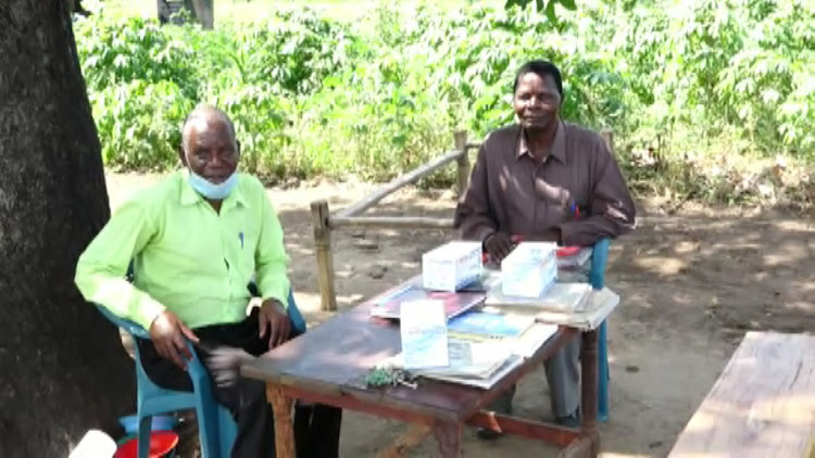 Teachers at Milimani community primary school in Malindi at their 'office' under a cashwenut tree