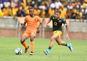 Polokwane City's Oswin Appollis and Yusuf Maart of Kaizer Chiefs during the DStv Premiership match at Peter Mokaba Stadium on December 09, 2023.