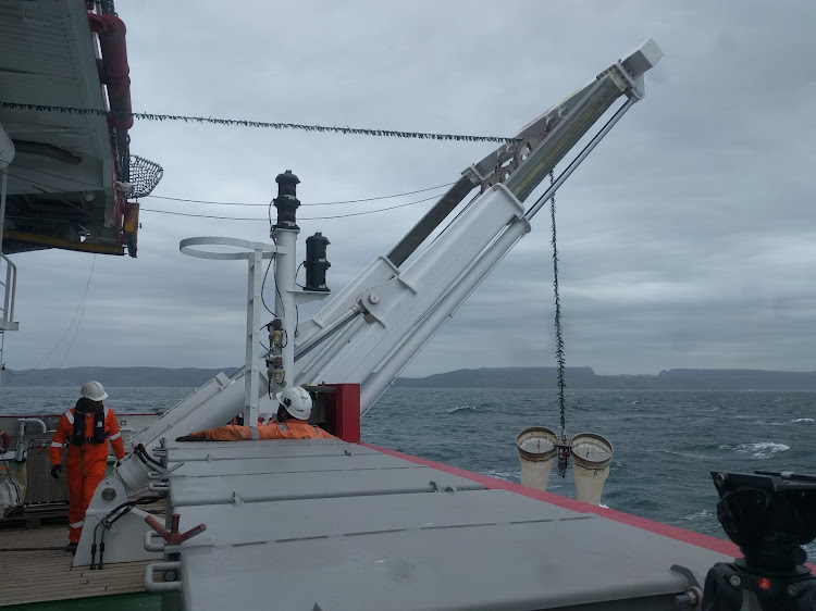 South African scientists test their equipment for the International Indian Ocean Expedition II. Bongo nets are lowered into the ocean to collect plankton.