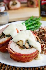 Bacon Wrapped, Mushroom and Spinach Stuffed Pork Tenderloin in a Creamy Dijon Goat Cheese Sauce was pinched from <a href="https://www.closetcooking.com/bacon-wrapped-mushroom-and-spinach/" target="_blank" rel="noopener">www.closetcooking.com.</a>