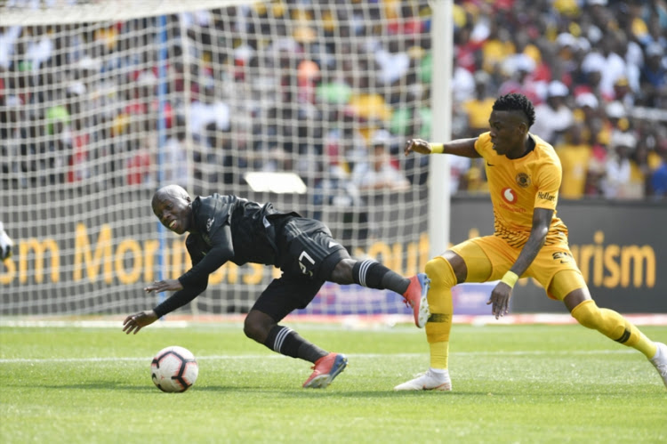 Ben Motshwari of Kazier Chiefs and Teenage Hadebe of Orlando Pirates during the Absa Premiership match between Orlando Pirates and Kazier Chiefs at FNB Stadium on February 09, 2019 in Johannesburg, South Africa.