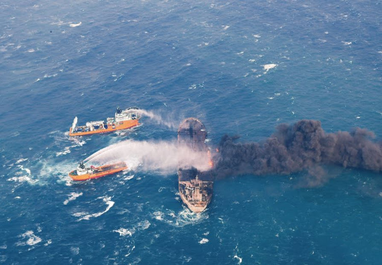 Rescue ships work to extinguish the fire on the Panama-registered Sanchi tanker carrying Iranian oil, which went ablaze after a collision with a Chinese freight ship in the East China Sea, in this January 10, 2018 picture provided by China's Ministry of Transport and released by China Daily.