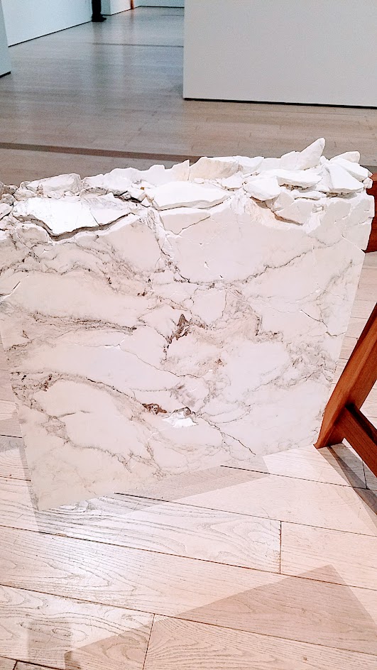 Draped Marble (Carrara, St. Laurant, Brown Onyx) by Analia Saban. Marble mounted on steel on wooden sawhorse. Displayed at Broad Contemporary Art Museum at LACMA