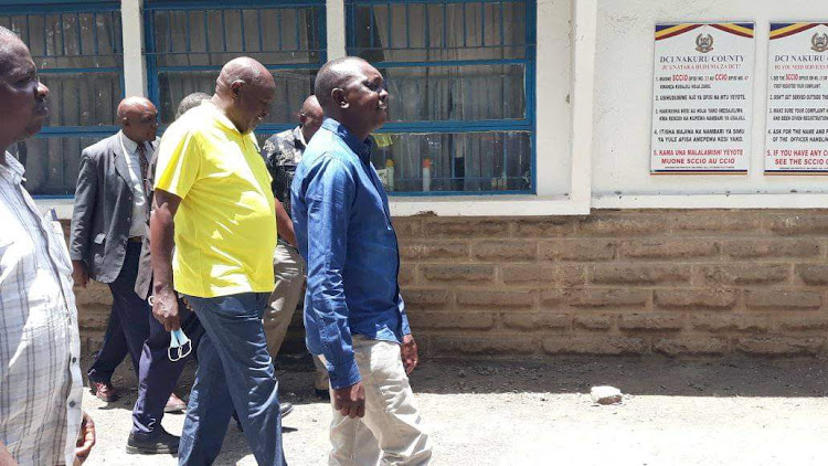 Kapsaret MP Oscar Sudi and Soy MP Caleb Kositany at the Nakuru DCI HQ on April 3, 2022.
