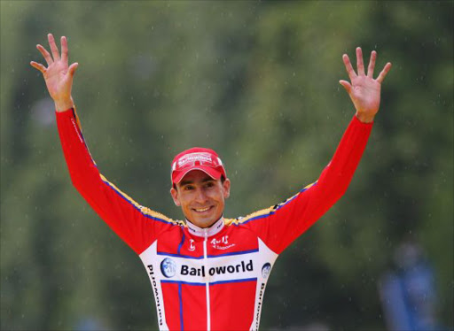 Polka Dot King of the Mountains jersey winner Juan Mauricio Soler Hernandez of Colombia and Barloworld celebrates on the podium after Stage Twenty of the Tour de France on July 29, 2007 in Paris, France. (Photo by Bryn Lennon/Getty Images)