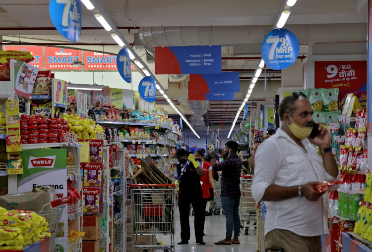 Customers buy grocery items inside a store of Reliance Industries, in Mumbai, India. Picture: NIHARIKA KULKARNI/REUTERS