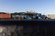 Members of the US Navy stand on the USS Kentucky ballistic missile submarine in Busan, South Korea, on Wednesday, July 19, 2023. North Korea launched two missiles into waters off its east coast in a show of anger hours after the US brought a submarine capable of firing nuclear ballistic missiles to a port in South Korea for the first time in about four decades. Photographer: SeongJoon Cho/Bloomberg