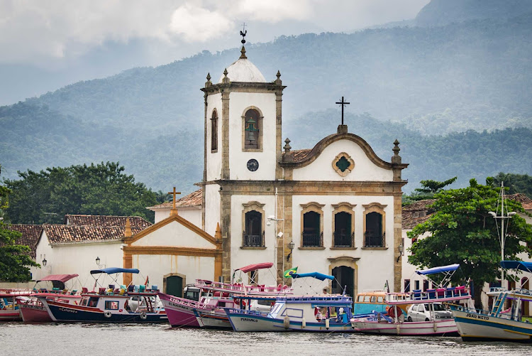 Visit Paraty, a small town backed by mountains on Brazil's Costa Verde, on a Ponant cruise.