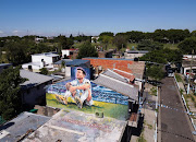 A mural depicting Argentine soccer star Lionel Messi is seen on top of the home where he was born, in Rosario, Argentina December 15, 2022.