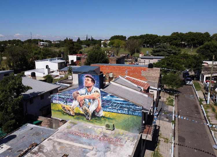 A mural depicting Argentine soccer star Lionel Messi is seen on top of the home where he was born, in Rosario, Argentina December 15, 2022.