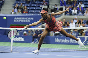 Venus Williams of the United States returns a shot during her women's singles fourth round match against Carla Suarez Navarro of Spain on Day Seven of the 2017 US Open at the USTA Billie Jean King National Tennis Center on September 3, 2017 in the Flushing neighborhood of the Queens borough of New York City.