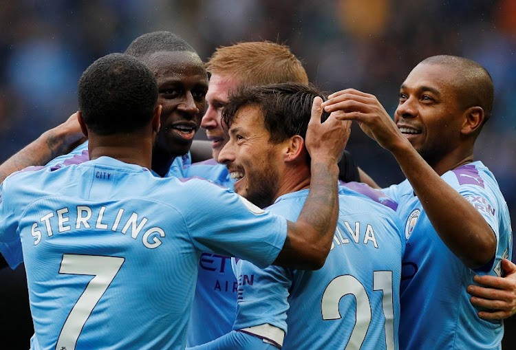 Manchester City's Kevin De Bruyne celebrates scoring their second goal with team mates between Manchester City and Aston Villa at the Etihad Stadium in Manchester, north west England, on October 26, 2019.