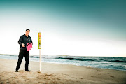 The NSRI’s Andrew Ingram with a pink rescue buoy. 
