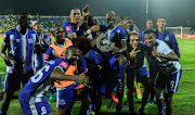 Maritzburg United players celebrate with midfielder Siphesihle Ndlovu after he won the match of the match award following an Absa Premiership match at home to Mamelodi Sundowns at Harry Gwala Stadium on Wednesday April 25 2018. 