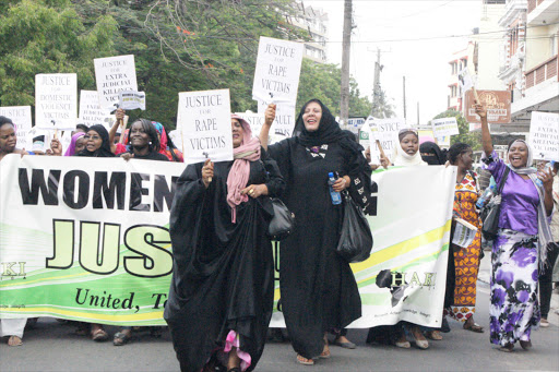 Family members of victims of extrajudicial killings and human rights activists Haki Africa march peacefully to the Central police station in Mombasa to present their grievances,