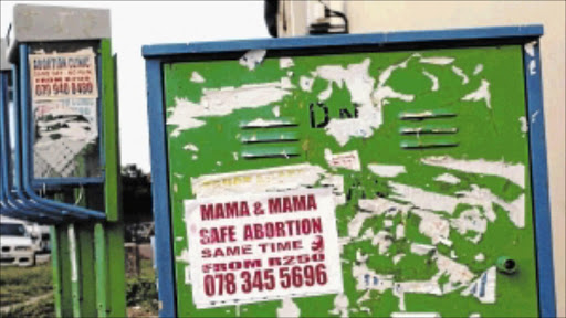 BACK-DOOR WAY: Back street abortion posters that litter Durban's city centre PHOTO: Thuli Dlamini