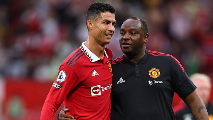 Cristiano Ronaldo celebrates Manchester United's 3-1 victory over Arsenal with SA coach Benni McCarthy.