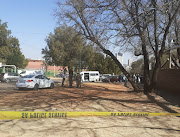 A minibus taxi and Toyota allegedly used by the suspects at the crime scene.