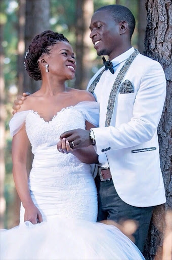 WEDDING DAY BLISS: Livhuwani Malivhoho and his wife Vhutshilo before tragedy struck on a beach in Mozambique where they had gone for their honeymoon PHOTO: SUPPLIED