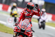 Francesco Bagnaia celebrates on his bike after setting the fastest time during MotoGP qualifying on June 25, 2022 at the TT circuit of Assen, Netherlands.