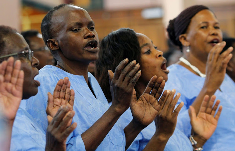 Choir members sing Christmas carols as they celebrate Christmas Mass at the Holy Family Basilica in Nairobi, Kenya December 25, 2019.