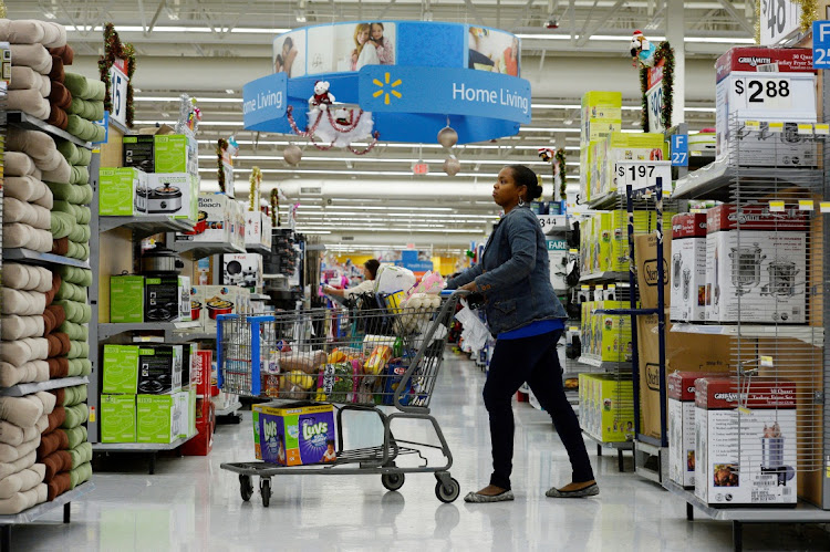 A customer pushes her shopping cart through a Walmart store in Los Angeles, the US. Picture: KERVORK DJANSEZIAN/REUTERS