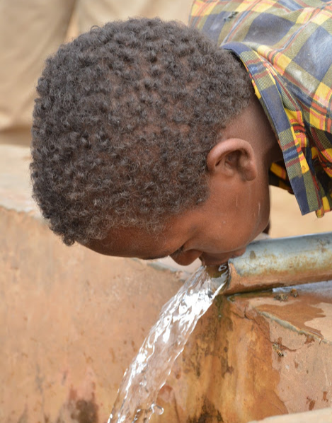 A boy drinks water