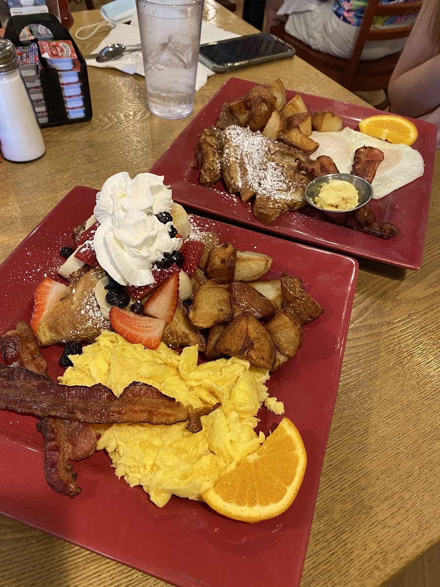 Gluten free French toast is the farest plate! My friend got the regular French toast with the fruit on it!