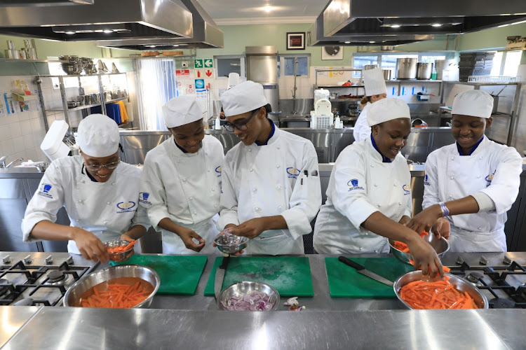 Banyana Monyuku, Ruth Tshibangu , Jonathan Pembe, Charlie Nakazwe and Oratile Mputla preparing food at the HTA cooking school in Bram Fisher Dr, Randburg. Picture: Thapelo Morebudi.