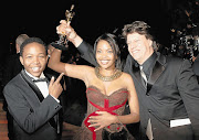 Cast members of the film Tsotsi, Presley Chweneyagae, Terry Pheto, and director Gavin Hood at the 2006 Oscar Awards. 