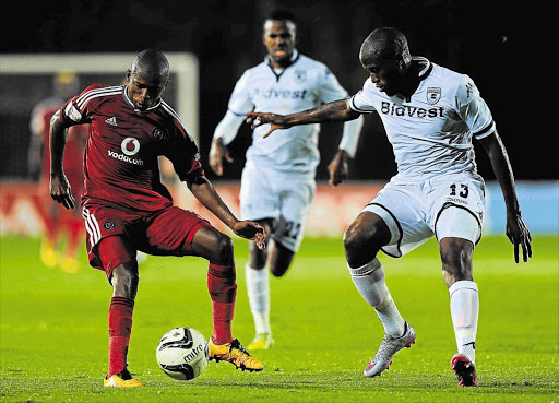 RAZZLE-DAZZLE: Sifiso Hlanti, right, of Wits in action against ILuvuyo Memela of Pirates during their league match at Bidvest Stadium last night. Wits won 1-0 Picture: GALLO IMAGES