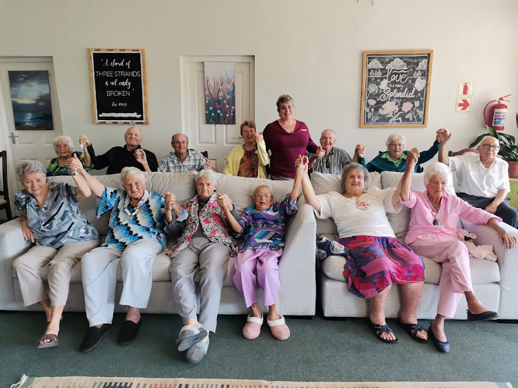 Sister Sandy Swartz, standing, goes beyond the line of duty to ensure a happy stay for the residents of Kidd’s Beach Care Centre.