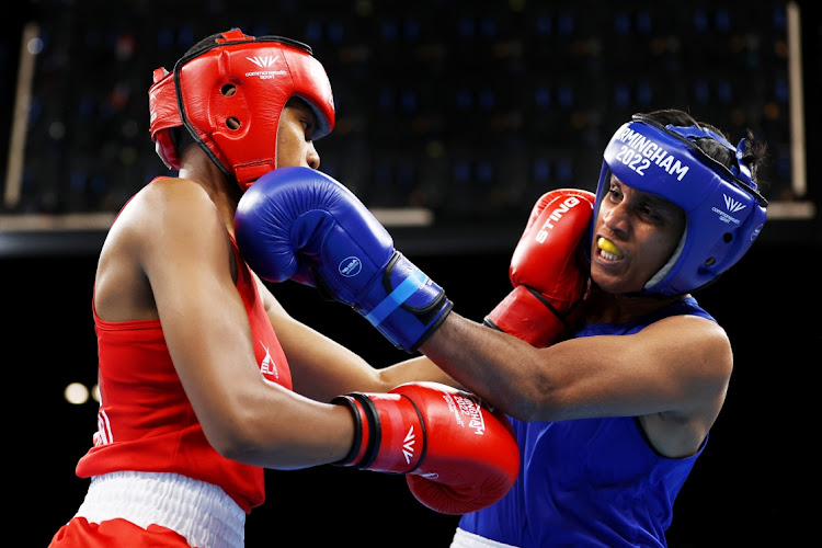 Phiwokuhle Sbusisiwe Mnguni, in red, in her fight against Sajeewani Coorey Muthuthanthri of Sri Lanka at the Commonwealth Games on Thursday.