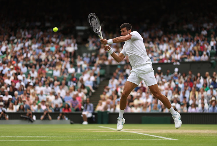 Novak Djokovic of Serbia in action against Andrey Rublev during their quarterfinal on day nine of The Championships Wimbledon 2023 at All England Lawn Tennis and Croquet Club in London on July 11 2023.