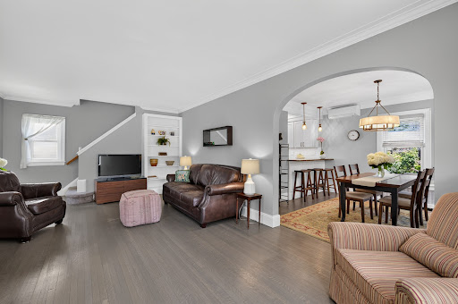 Open living and dining room - Buy this luxury property in Locust Valley, 3 bedrooms
