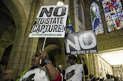 Demonstrators make their feelings clear during a gathering at St George's Cathedral in Cape Town at the time of President Jacob Zuma's state of the nation address in February.