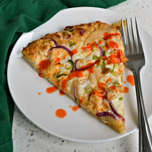 This mouthwatering good pizza is topped with ranch, hot sauce, rotisserie chicken, red onions, scallions and plenty of mozzarella. Drizzle with a little hot sauce and take this pizza to another level.