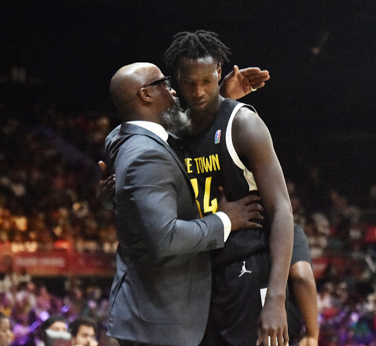 Cape Town Tigers CEO and co-founder Raphael Edwards comforts the youngest player in his team, Yakhya Diop, during their 2024 Basketball Africa League match against FUS Rabat at the SunBet Arena in Pretoria on Sunday.