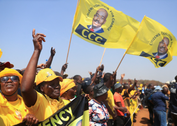 Supporters of Zimbabwe's main opposition leader of Citizens Coalition for Change (CCC), Nelson Chamisa, wave flags during the party's final rally before the elections in Harare.