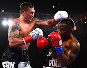 Oleksandr Usyk of the Ukraine tags Thabiso Mchunu of SA on his way to win the WBO Cruiserweight title.