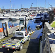 One of the alleged poachers' boats is pulled out of the water at Cape Town harbour on February 27 2020.